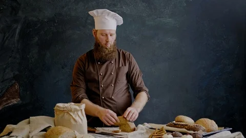Chef eats a slice of freshly prepared bread to check the quality 스톡 동영상 103351004
