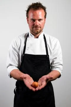 Chef with egg Stock Photos