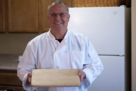 Chef with empty cutting board Stock Photos