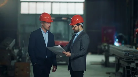 Chef engineer and architect standing in the middle of production zone in the Stock Footage 255803218