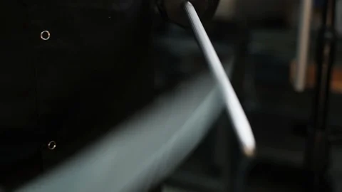 A chef in a European restaurant professionally sharpens a cook's knife on a 库存影片 106936408