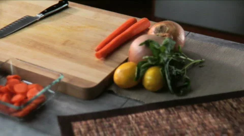 Chef expertly chopping carrots Stock Footage