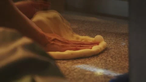 The chef is expertly tossing the dough, crafting the perfect pizza base. Stock Footage 283432828