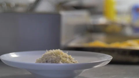Chef explaining his gourmet rise dish Chef presenting his rise dish Stock Footage 127064891