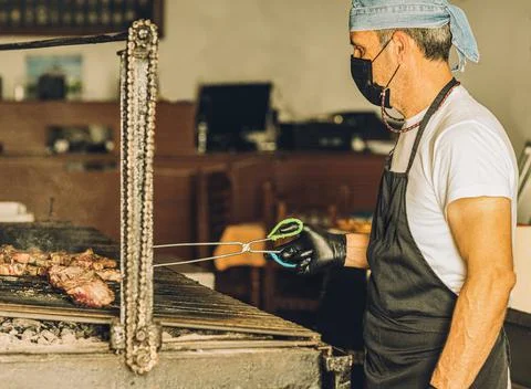 Chef in Face Mask Working Stock Photos