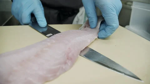 Chef filleting the fish in the kitchen Video stock 163317819