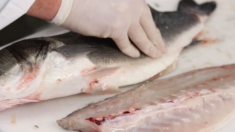 The chef fillets and cleans a fish Stock Footage 121499936