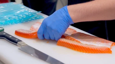 Chef Fills in Salt and Slices Fresh Raw Salmon. Stock Footage