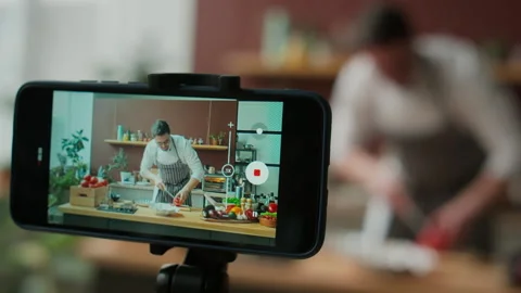 Chef Filming Cooking Video in Kitchen Stock Footage 266977586