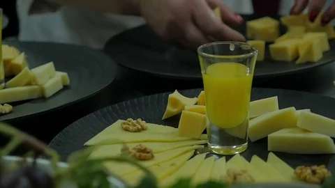Chef finalizing a cheese in a kitchen. Slow motion. Stock Footage 74405483