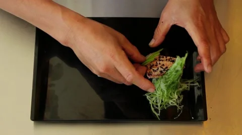 Chef fixing a nice plate of sushi Stock Footage 12145062
