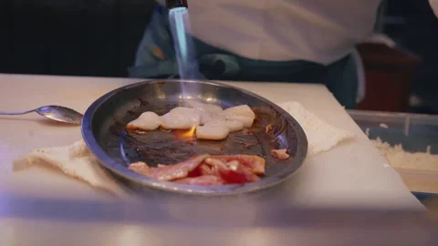 Chef flambeing squid with eel sauce – 4K video Stock Footage 315565015