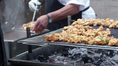 Chef flipping over and removing chicken sate from bbq Stock Footage 92081763