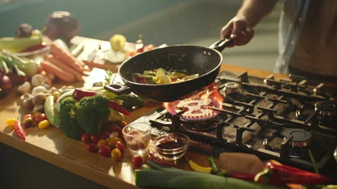 Chef flipping vegetables in frying pan Stock-Footage 311835129