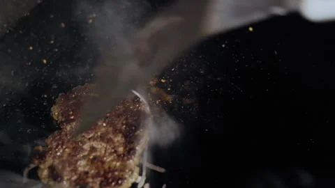 Chef Flips Sizzling Patty and Adds Cheese Stock-Footage 307074821