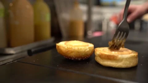 Chef Fork Puts Caramelized Onion On A Burger. 4k Slow Motion Stock Footage 180440322