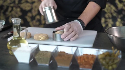 The chef forms cutlets using a mold. Pike and seasoning cutlets Stock Footage 126444897