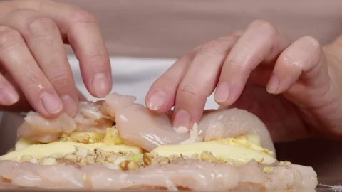 Chef forms a roll of chicken fillet 스톡 동영상 165503026