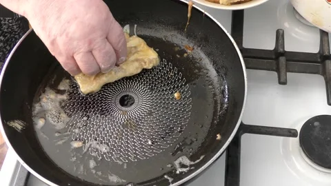 The chef fries fish in a pan Stock Footage 165208657