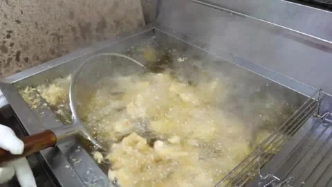 Chef Frying Crispy Korean Fried Chicken Pieces in Commercial Deep Fryer Video stock 343028875