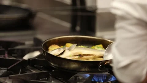The chef is frying fish 15 Stock Footage 312943787