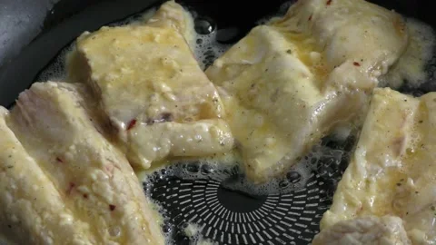 Chef frying fish in a pan Stock Footage 171980961
