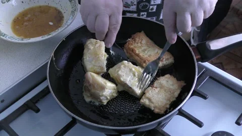 Chef frying fish in a pan for lunch Stock Footage 197546196