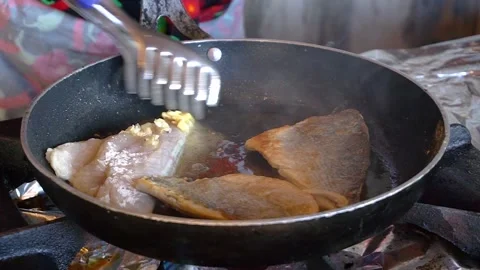 Chef frying fish in a pan in restaurant kitchen Stock Footage 342378862