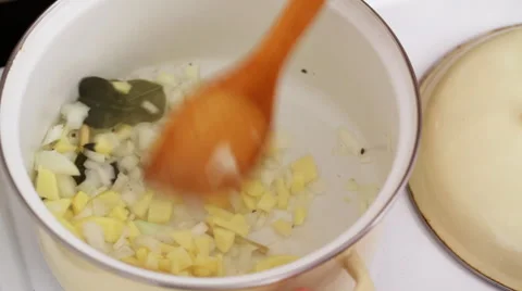 Chef frying ginger and onions, closeup Stock Footage 56346208