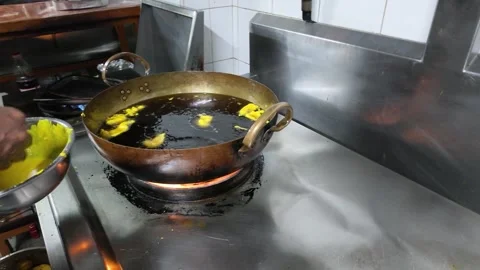 Chef Frying Vegetable Pakoras in Hot Oil Wok in Commercial Kitchen Stock Footage 339122590