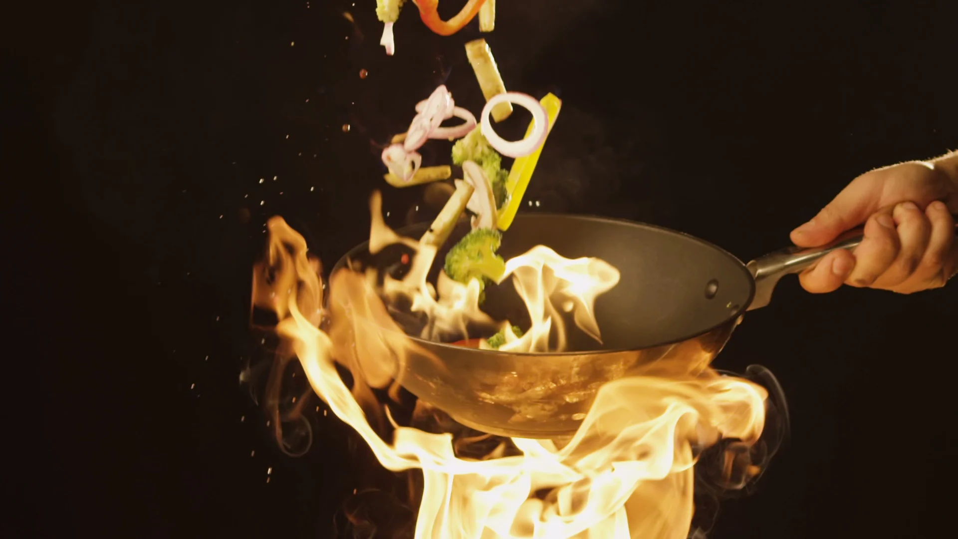 https://images.pond5.com/chef-frying-vegetables-fire-throwing-086752348_prevstill.jpeg