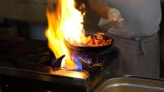https://images.pond5.com/chef-frying-vegetables-fire-throwing-footage-116489479_iconm.jpeg
