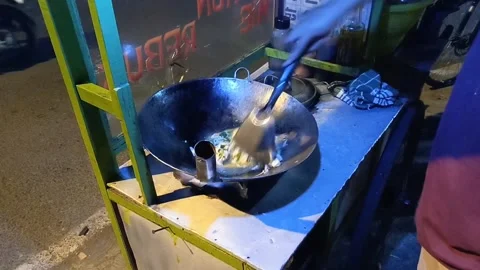 The chef is frying vegetables in the form of cabbage, mustard greens, carrots Stock Footage 287327395
