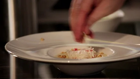 Chef garnishing risotto  Stock Footage 113275086