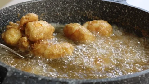 Chef gets out deep fried shrimps, close up Stock Footage 122121703