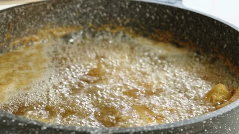 Chef gets out deep fried shrimps and put them on a plate, close up Stock Footage 122121747