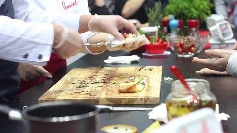 Chef gives tasters pizza Stock Footage 73425925