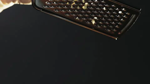 Chef in gloves grates delicious cheese for traditional pasta Stockbeeldmateriaal 149732543