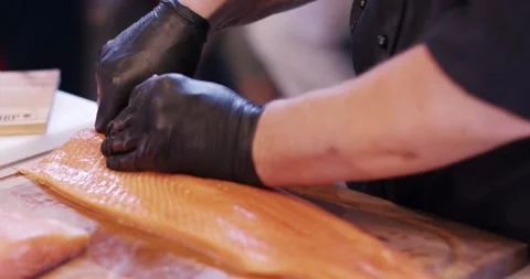 Chef in Gloves Preparing Salmon Fillet, Wooden Cutting Board, Close Up Shot Vídeo Stock 340324198