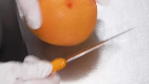 Chef in Gloves Slicing Ruby Red Grapefruit for Dessert Preparation Stock Footage 343019178