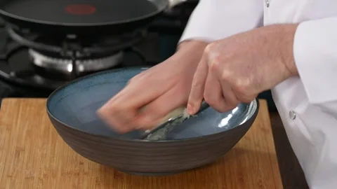 Chef grates onions Stock Footage 183557593