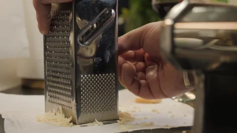The chef grates the parmesan on a grater Video stock 269569595