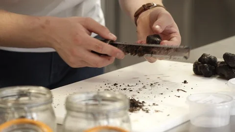Chef grating black truffle Stockbeeldmateriaal 92077080