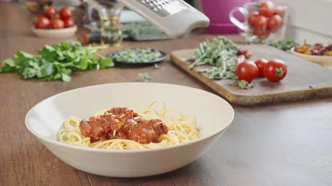 Chef grating cheese on the spaghetti Stock Footage 196968259