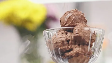 Chef grating dark chocolate on chocolate ice cream. 스톡 동영상 150885241
