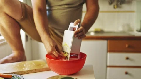 Chef grating ginger in domestic kitchen Stock Footage 321274549
