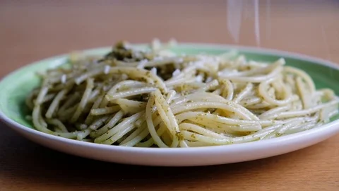 Chef grating hard cheese. Cooking pasta with pesto. A cook grater cheese 스톡 동영상 118073833