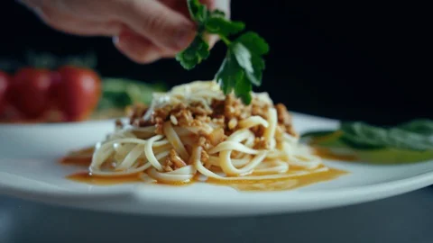 Chef grating hard cheese. Cooking pasta bolognese. Stock Footage 129939495