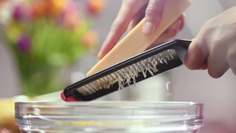 Chef grating parmesan cheese with a grater. 스톡 동영상 151046042