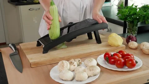 Chef grating zucchini Stock Footage 265658254